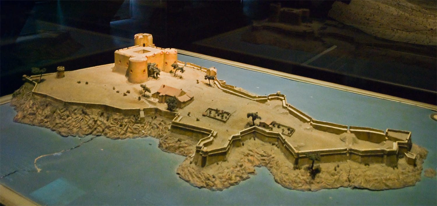 A relief map showing a fort on a small island.