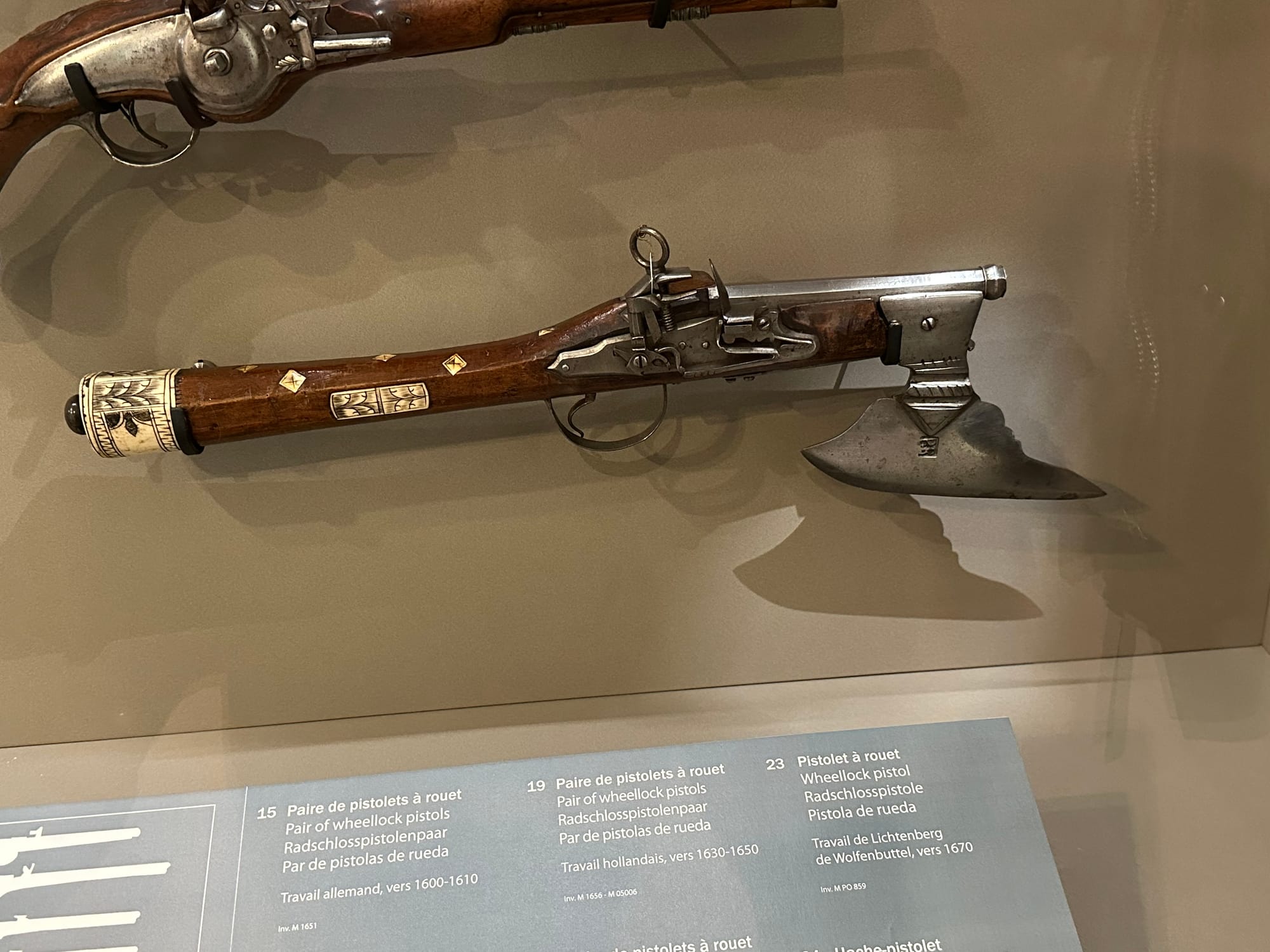 A pistol with an axe on its barrel.